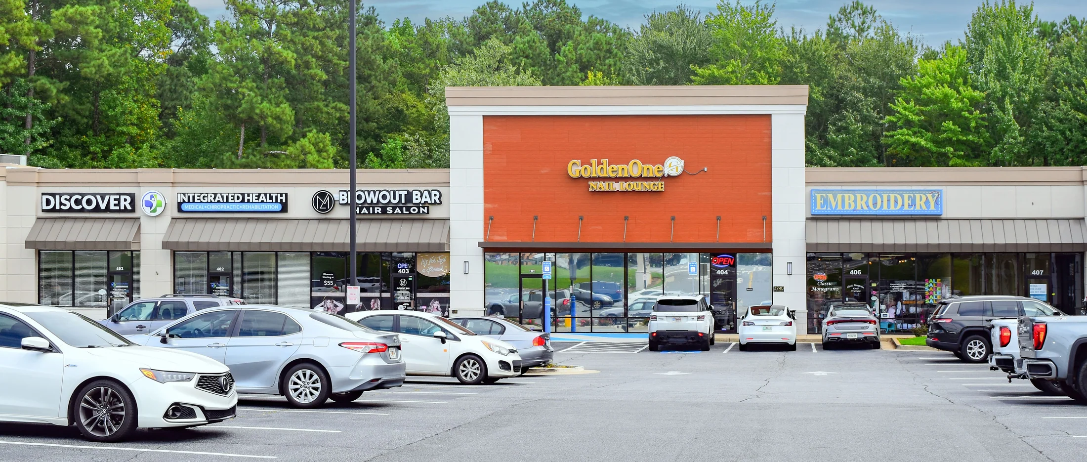 GoldenOne Nail Lounge and neighboring suites along the center's façade